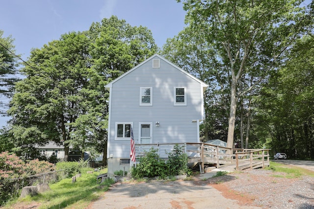 9 Jean St, Kittery, ME 03904 - rear view of house featuring a wooden deck and view of scattered trees