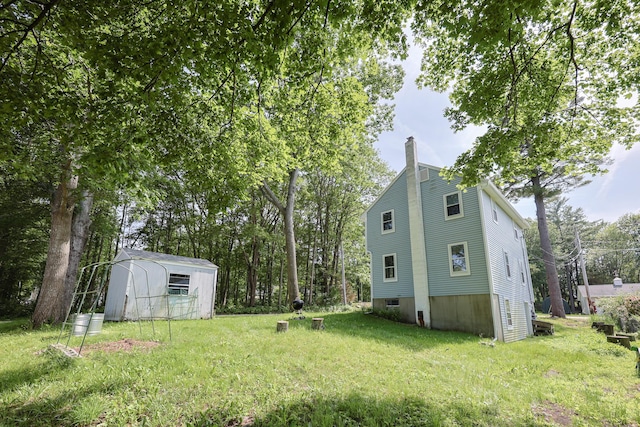 9 Jean St, Kittery, ME 03904 - view of green lawn with a shed
