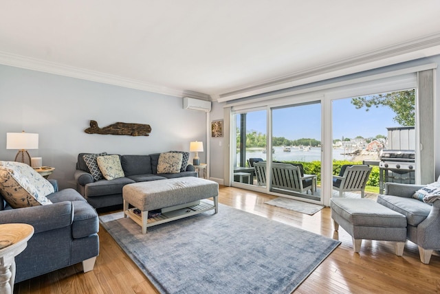 135 Ocean Ave Unit 15, Kennebunkport, ME 04046 - living area featuring crown molding, a water view, an AC wall unit, and wood finished floors