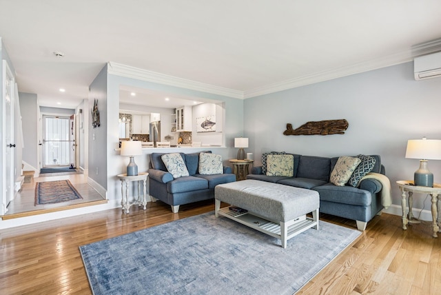 135 Ocean Ave Unit 15, Kennebunkport, ME 04046 - living room with light wood-style floors, a wall mounted air conditioner, crown molding, and recessed lighting