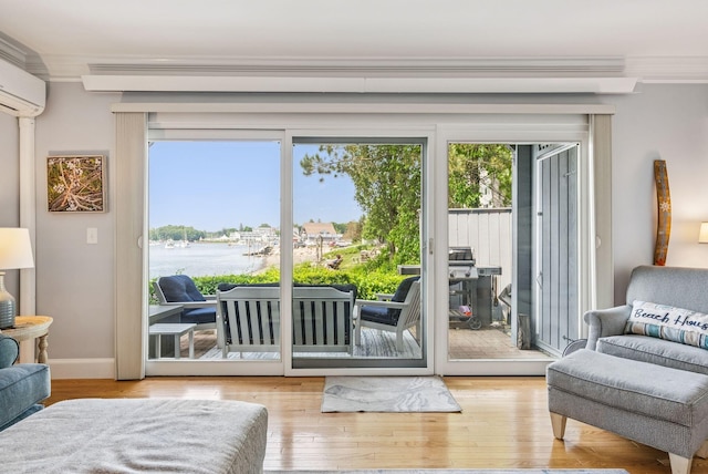135 Ocean Ave Unit 15, Kennebunkport, ME 04046 - doorway to outside featuring crown molding, hardwood / wood-style floors, and a wall mounted AC