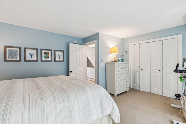 135 Ocean Ave Unit 15, Kennebunkport, ME 04046 - bedroom with light colored carpet, a closet, and a baseboard heating unit