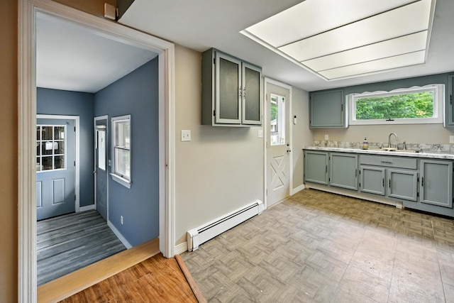 22 Sanborn Cir, Norway, ME 04268 - kitchen featuring baseboard heating, light countertops, and gray cabinets