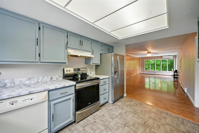 22 Sanborn Cir, Norway, ME 04268 - kitchen featuring stainless steel appliances, under cabinet range hood, ceiling fan, parquet flooring, and open floor plan