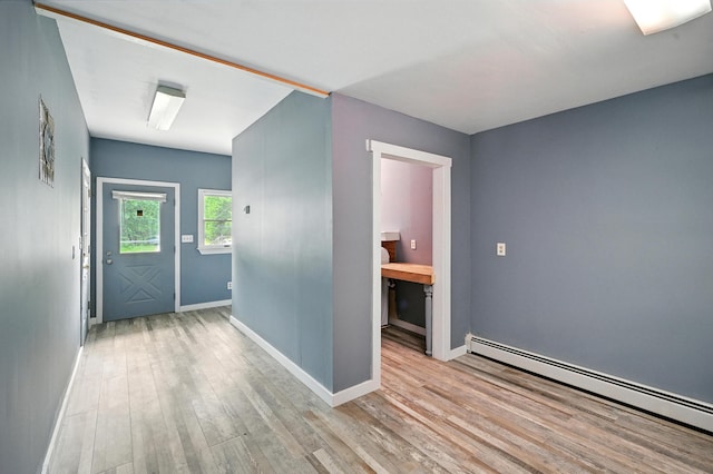 22 Sanborn Cir, Norway, ME 04268 - entrance foyer featuring a baseboard radiator and wood finished floors