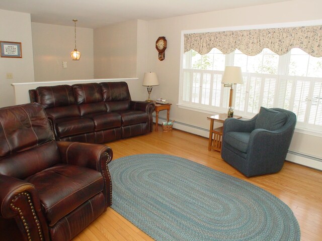 976 Essex St, Bangor, ME 04401 - living area with wood finished floors and baseboard heating