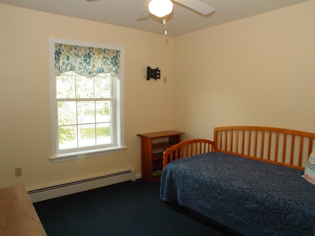 976 Essex St, Bangor, ME 04401 - carpeted bedroom with a baseboard heating unit and ceiling fan
