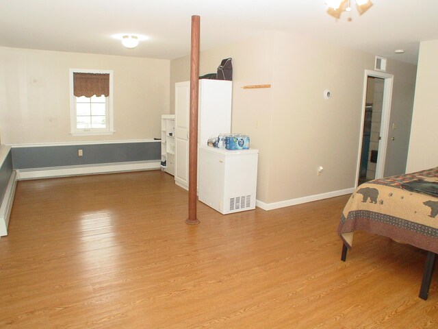 976 Essex St, Bangor, ME 04401 - bedroom with light wood-style floors and fridge