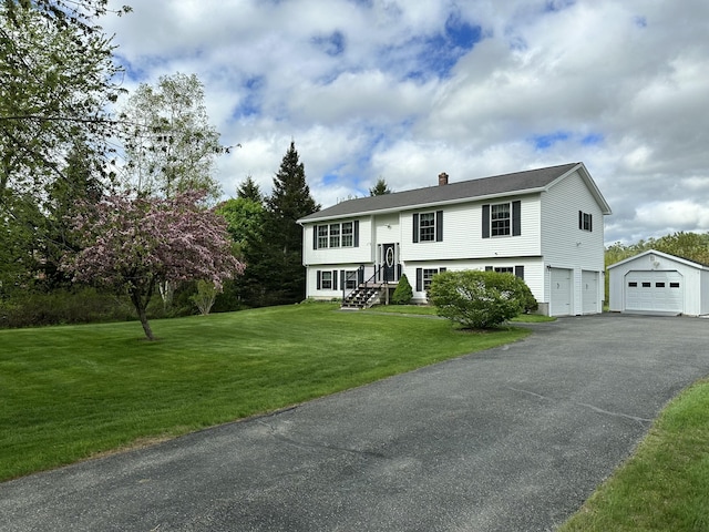 976 Essex St, Bangor, ME 04401 - raised ranch featuring a chimney, asphalt driveway, a front lawn, and an attached garage