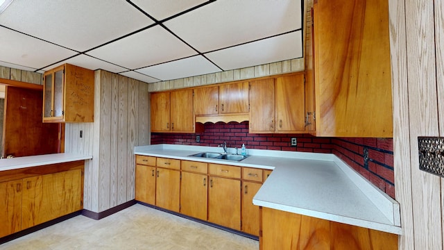 84 Elm St, Sabattus, ME 04280 - kitchen featuring brown cabinetry, a drop ceiling, light countertops, and light flooring