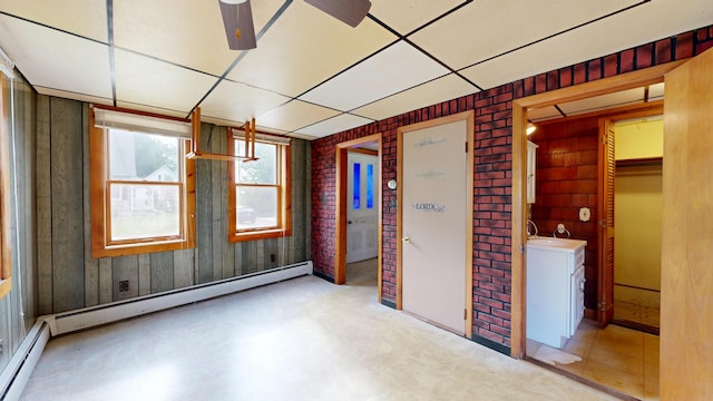 84 Elm St, Sabattus, ME 04280 - unfurnished room featuring a baseboard heating unit, ceiling fan, and a paneled ceiling