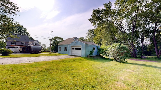 84 Elm St, Sabattus, ME 04280 - view of grassy yard featuring an outbuilding, a detached garage, and gravel driveway