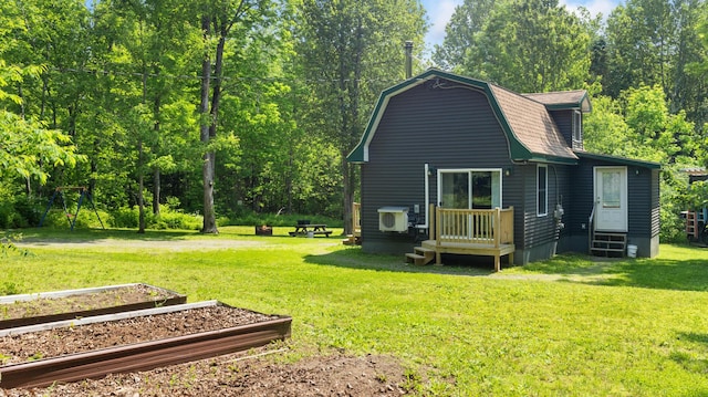 711 Stetson Rd, Exeter, ME 04435 - back of property featuring a vegetable garden, a gambrel roof, a yard, and entry steps