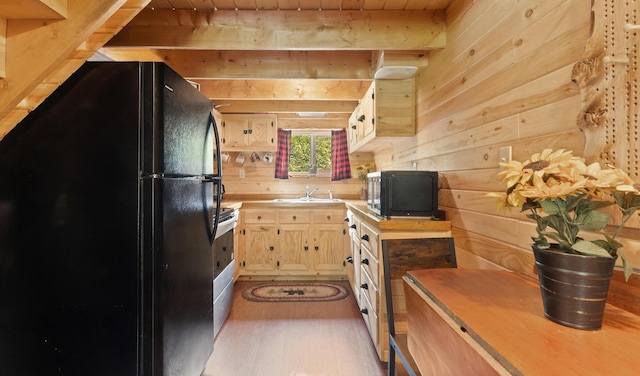 711 Stetson Rd, Exeter, ME 04435 - kitchen featuring freestanding refrigerator, wooden walls, a wood ceiling with exposed beams, stainless steel stove, and light wood-style flooring