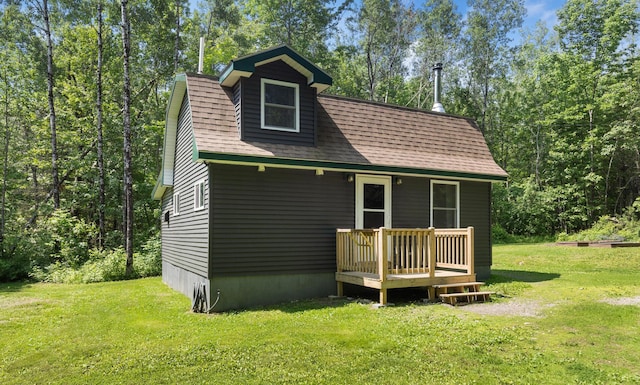 711 Stetson Rd, Exeter, ME 04435 - back of house with a yard, a shingled roof, and a deck
