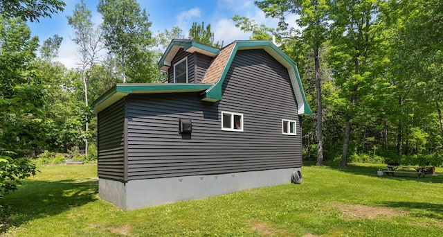 711 Stetson Rd, Exeter, ME 04435 - view of home's exterior featuring a yard and a gambrel roof