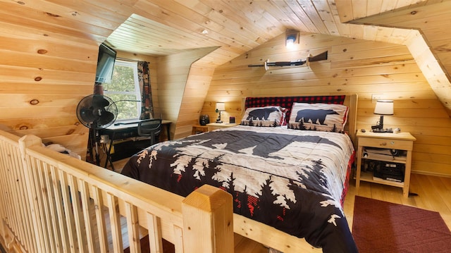 711 Stetson Rd, Exeter, ME 04435 - bedroom featuring wooden walls, hardwood / wood-style floors, wood ceiling, and vaulted ceiling