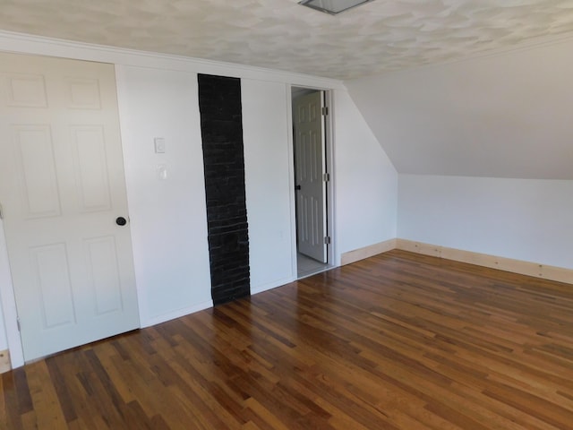 27 Main St, Norridgewock, ME 04957 - bonus room featuring wood finished floors, a textured ceiling, and lofted ceiling