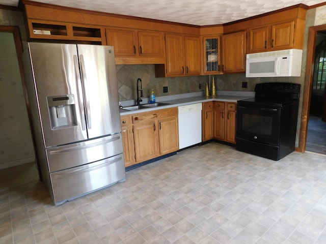 27 Main St, Norridgewock, ME 04957 - kitchen with white appliances, light countertops, brown cabinetry, and tasteful backsplash