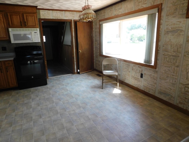 27 Main St, Norridgewock, ME 04957 - kitchen with white microwave, black range with electric cooktop, light flooring, wallpapered walls, and brown cabinets