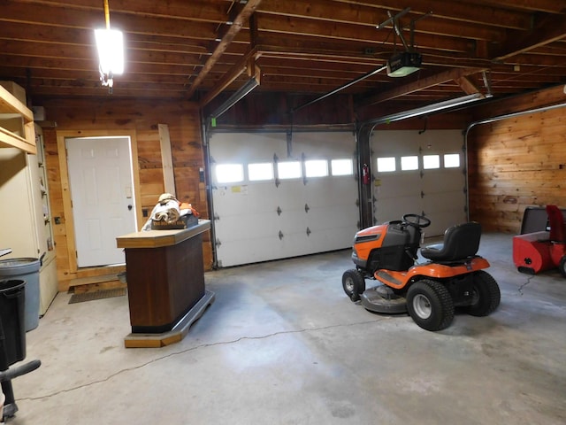 27 Main St, Norridgewock, ME 04957 - garage with a garage door opener and wood walls
