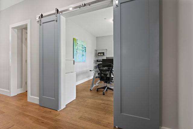 56 Ledgewood Dr, Falmouth, ME 04105 - office space featuring light wood-style flooring and a barn door