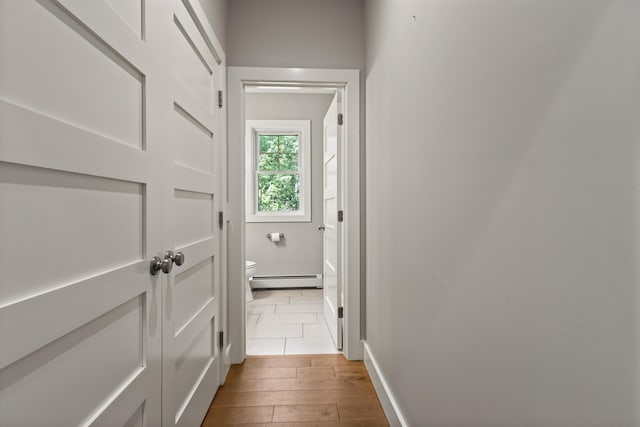 56 Ledgewood Dr, Falmouth, ME 04105 - corridor with wood-type flooring and a baseboard heating unit