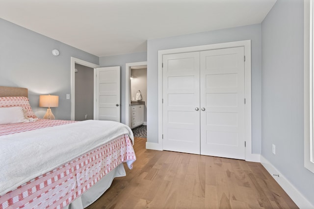 56 Ledgewood Dr, Falmouth, ME 04105 - bedroom featuring wood finished floors, a closet, and ensuite bathroom