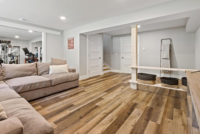 56 Ledgewood Dr, Falmouth, ME 04105 - living room with wood finished floors, stairway, and recessed lighting