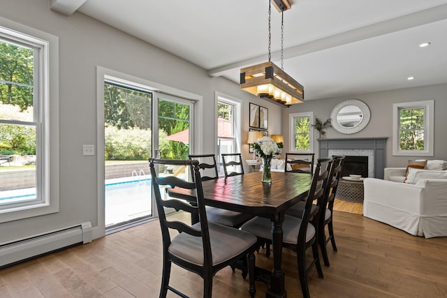 56 Ledgewood Dr, Falmouth, ME 04105 - dining room with healthy amount of natural light, wood finished floors, baseboard heating, recessed lighting, and beam ceiling