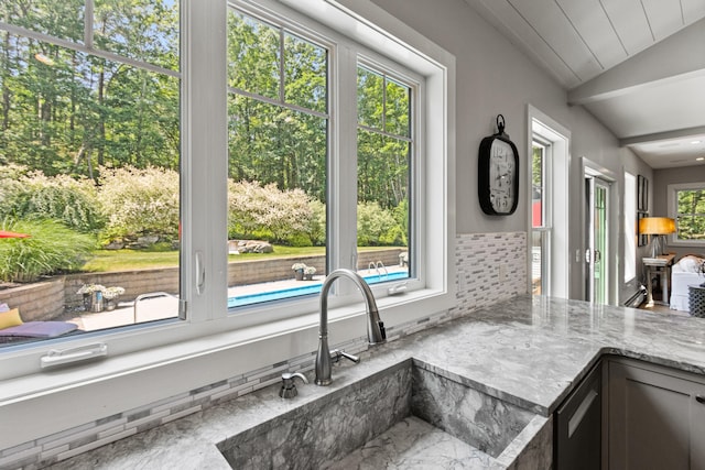 56 Ledgewood Dr, Falmouth, ME 04105 - kitchen with lofted ceiling, marble finish flooring, and light stone counters