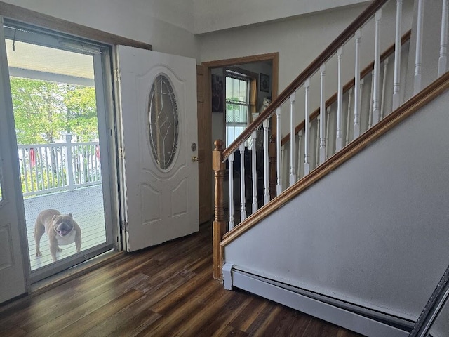 269 Bruckoff Rd, Clifton, ME 04428 - entrance foyer featuring a baseboard radiator, dark wood-type flooring, healthy amount of natural light, and stairs