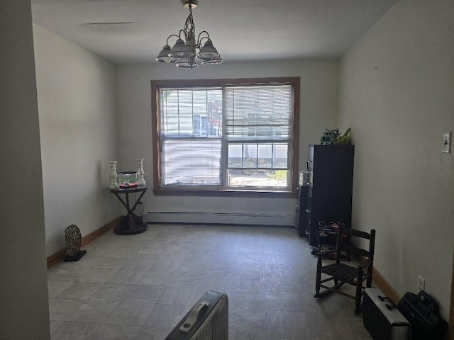269 Bruckoff Rd, Clifton, ME 04428 - dining room with a baseboard heating unit and a chandelier