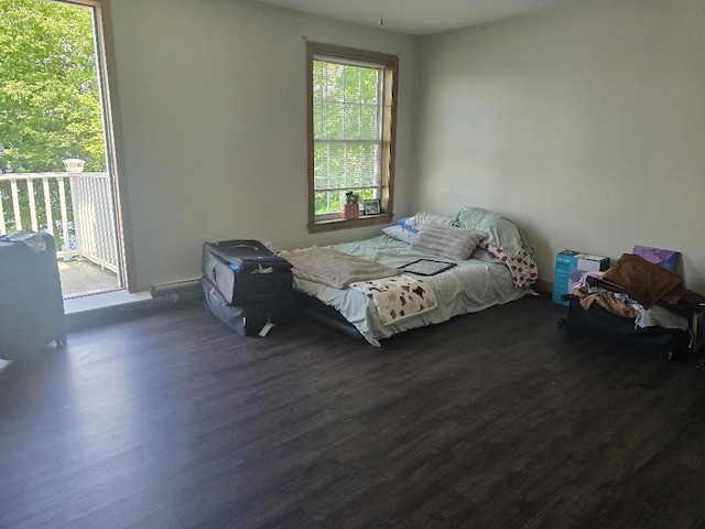 269 Bruckoff Rd, Clifton, ME 04428 - bedroom with dark wood-style floors and access to exterior