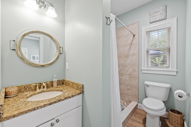 18 Frontier Way Unit 162, Arundel, ME 04046 - bathroom featuring vanity, wood finished floors, and a tile shower