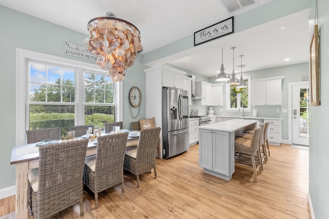 18 Frontier Way Unit 162, Arundel, ME 04046 - dining room featuring a chandelier and light wood-style flooring