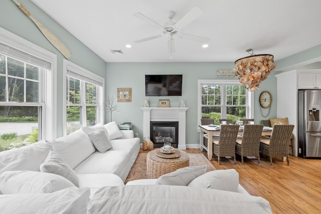 18 Frontier Way Unit 162, Arundel, ME 04046 - living room featuring recessed lighting, light wood-style floors, a ceiling fan, and a glass covered fireplace