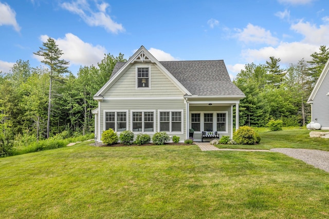 18 Frontier Way Unit 162, Arundel, ME 04046 - back of house featuring a lawn and roof with shingles
