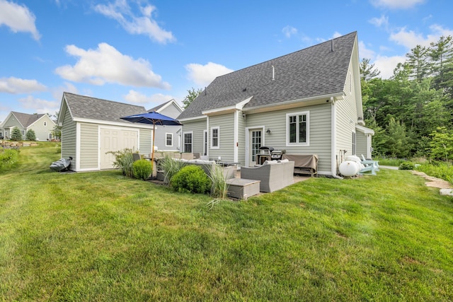 18 Frontier Way Unit 162, Arundel, ME 04046 - rear view of house with an outdoor living space, a yard, an outbuilding, and a shingled roof