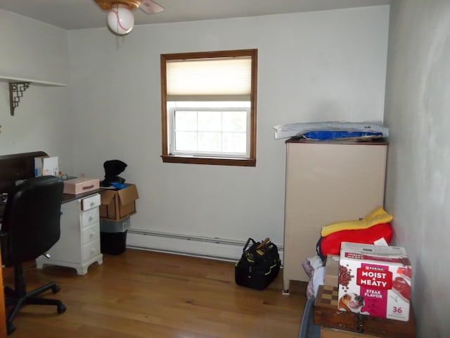 583 River Rd, Calais, ME 04619 - office featuring baseboard heating, wood finished floors, and a ceiling fan