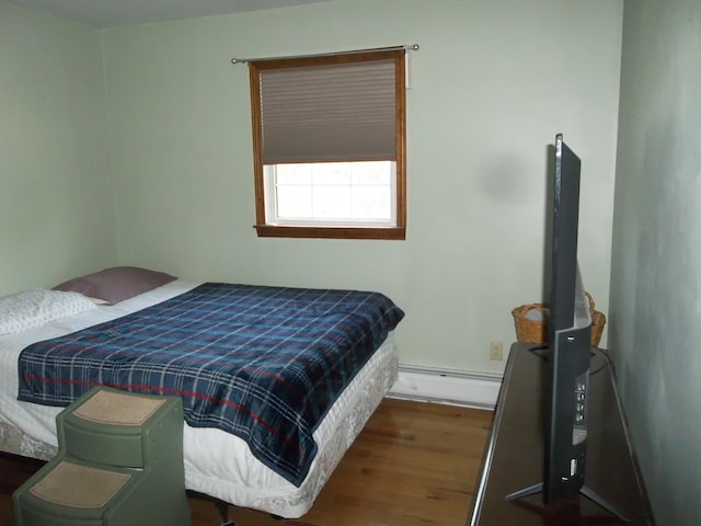 583 River Rd, Calais, ME 04619 - bedroom with a baseboard radiator and wood finished floors
