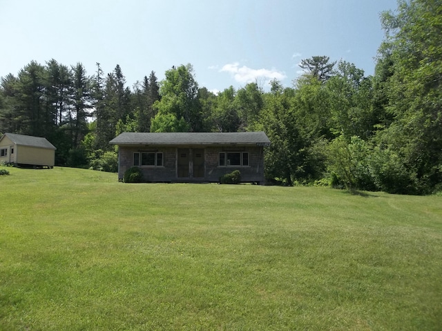 583 River Rd, Calais, ME 04619 - view of front facade with a front lawn, french doors, and a forest view