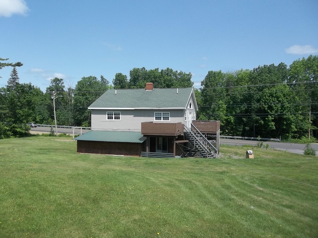 583 River Rd, Calais, ME 04619 - rear view of property with stairs, a chimney, and a deck