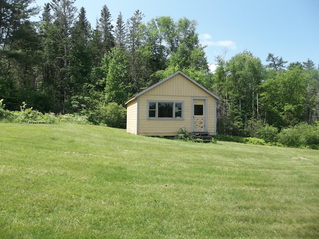 583 River Rd, Calais, ME 04619 - view of home's exterior with a yard and an outdoor structure
