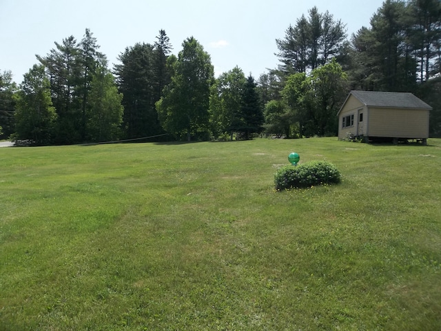 583 River Rd, Calais, ME 04619 - view of grassy yard with an outbuilding