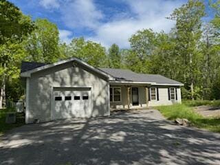 408 Chopps Cross Rd, Woolwich, ME 04579 - ranch-style house featuring a garage and asphalt driveway