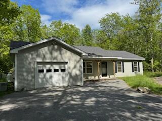 408 Chopps Cross Rd, Woolwich, ME 04579 - ranch-style home with a garage and asphalt driveway