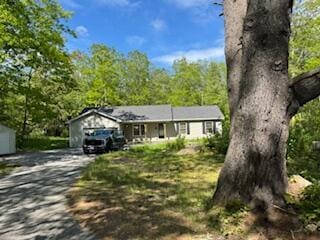 408 Chopps Cross Rd, Woolwich, ME 04579 - ranch-style home with driveway and a wooded view