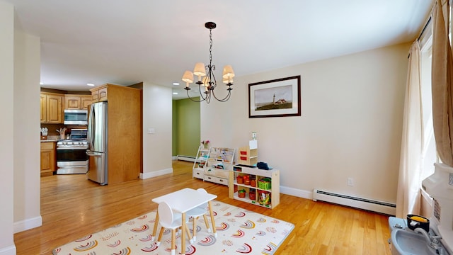 3 Marr Farm Way, Scarborough, ME 04074 - recreation room with a baseboard heating unit, light wood-style flooring, a chandelier, and recessed lighting
