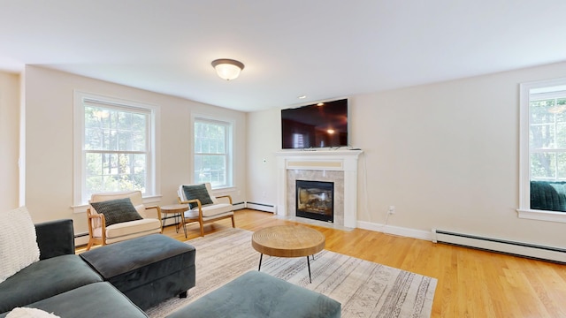 3 Marr Farm Way, Scarborough, ME 04074 - living room featuring wood finished floors, a fireplace, and a baseboard radiator